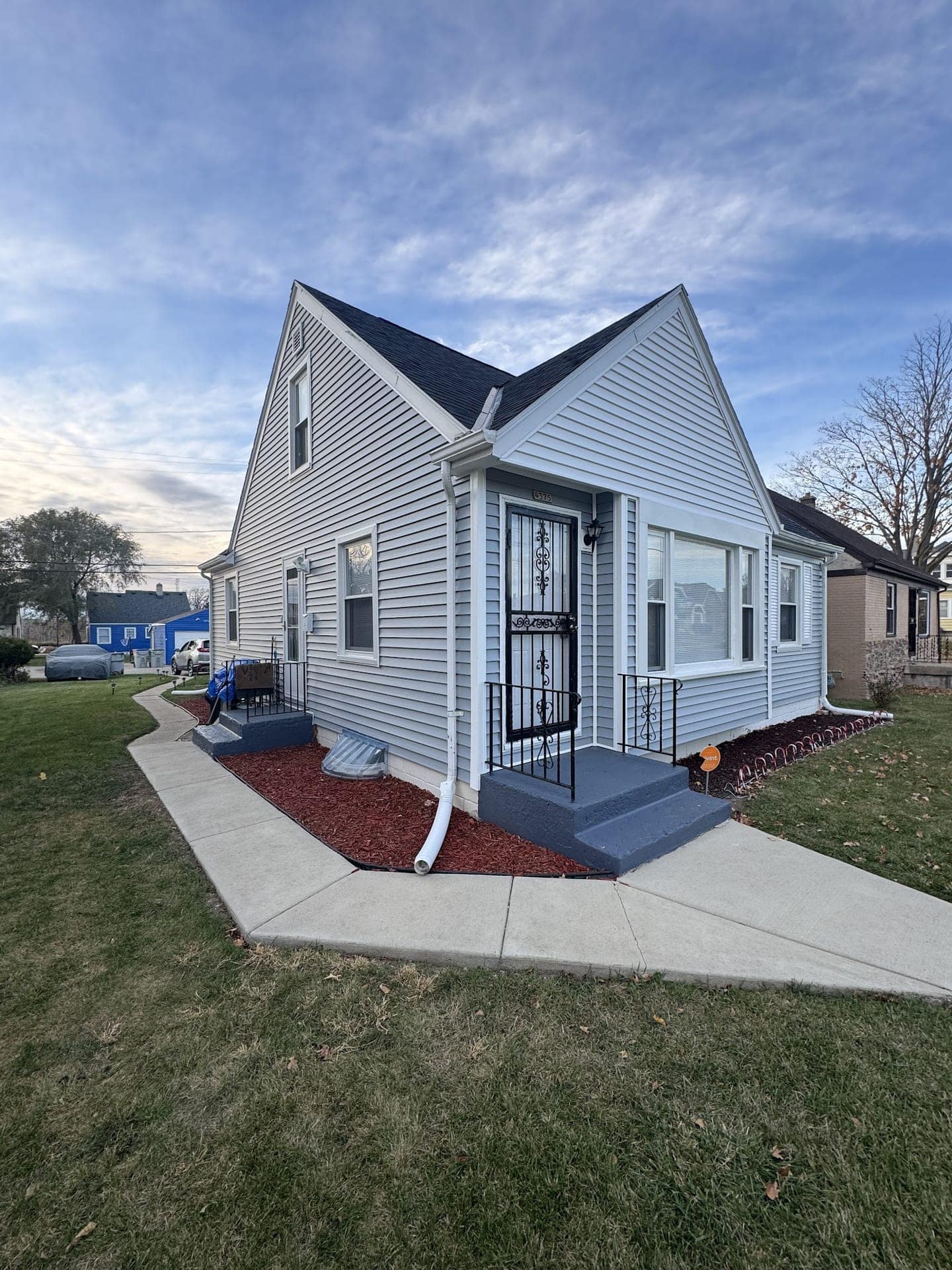 Completed roof and siding replacement on a Milwaukee home by Apexium Roofing